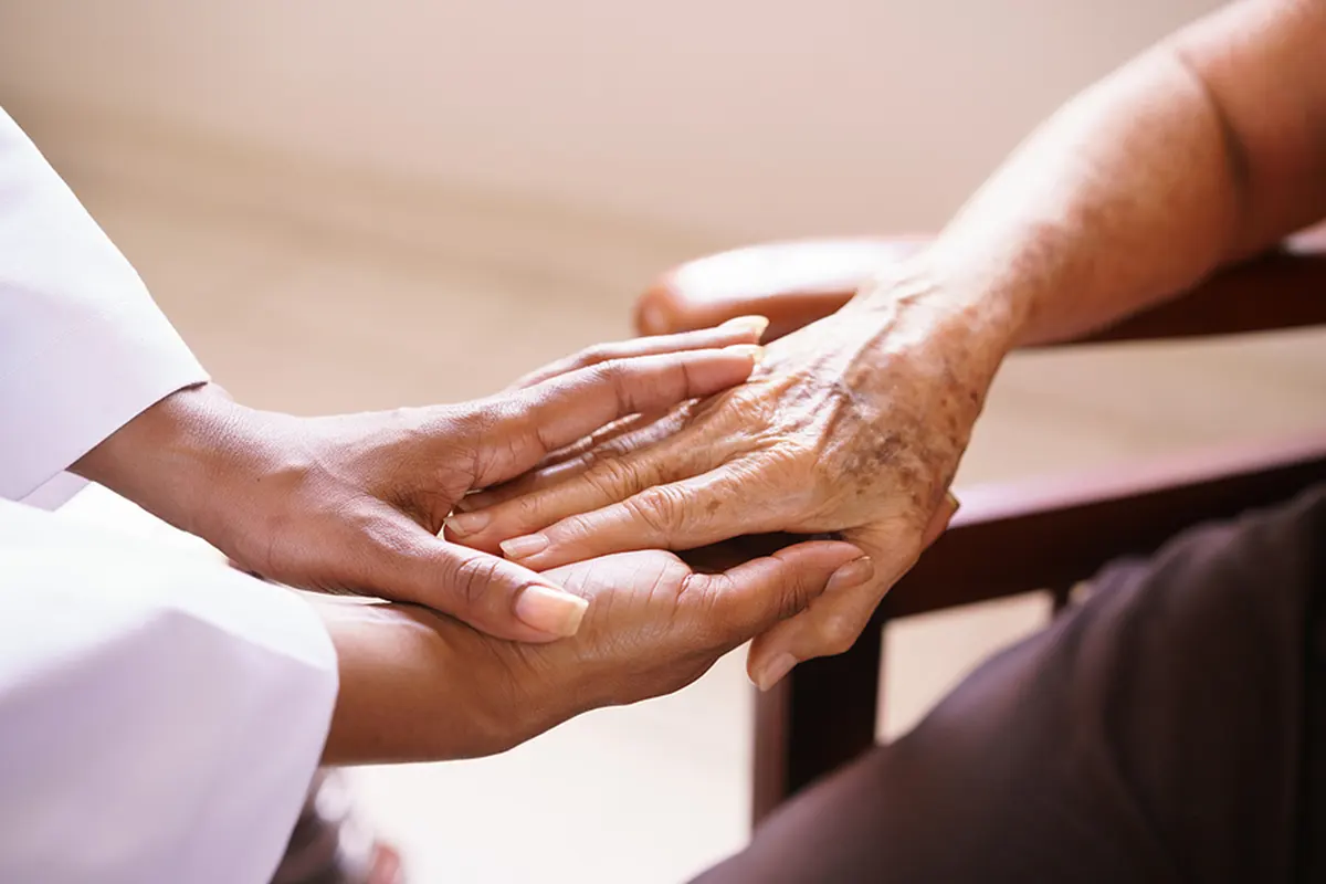 holding hands with an elderly loved-one